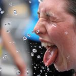 BERN, 12JUN16 - Die Tropfen vom Himmel reichten einigen Laeuferinnen nicht, sich abzukuehlen. Feuerwerschlaeuche auf der Strecke und im Ziel spendeten anlaesslich des 30. Schweizer Frauenlauf in Bern am 12. Juni 2016 kuehlendes Nass.Impression of the 30th Swiss Women's Run in Bern, Switzerland, June 12, 2016. With more than 16,000 participants, the Swiss Women's Run is the largest women's sports event in Switzerland.swiss-image.ch/Photo Andy Mettler