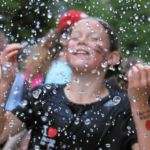 BERN, 12JUN16 - Die Tropfen vom Himmel reichten einigen Laeuferinnen nicht, sich abzukuehlen. Feuerwerschlaeuche auf der Strecke und im Ziel spendeten anlaesslich des 30. Schweizer Frauenlauf in Bern am 12. Juni 2016 kuehlendes Nass.Impression of the 30th Swiss Women's Run in Bern, Switzerland, June 12, 2016. With more than 16,000 participants, the Swiss Women's Run is the largest women's sports event in Switzerland.swiss-image.ch/Photo Andy Mettler